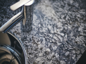 close up of azul aran tap and sink stone from grama blend uk