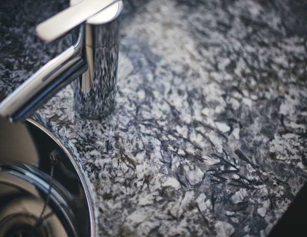 close up of azul aran tap and sink stone from grama blend uk