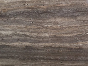 close up of brown silver travertine stone from grama blend uk