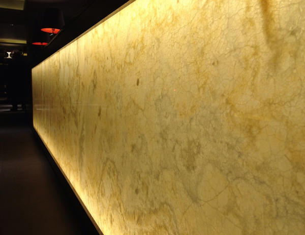 Caramel onyx backlit stone reception desk Hilton hotels