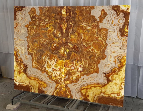 slab of brown symmetrical stone from grama blend uk