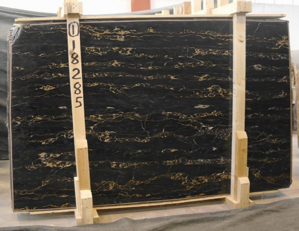 slab of nero portoro stone from grama blend uk