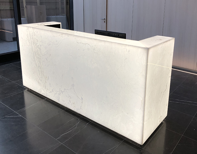 backlit white onyx reception desk from grama blend uk